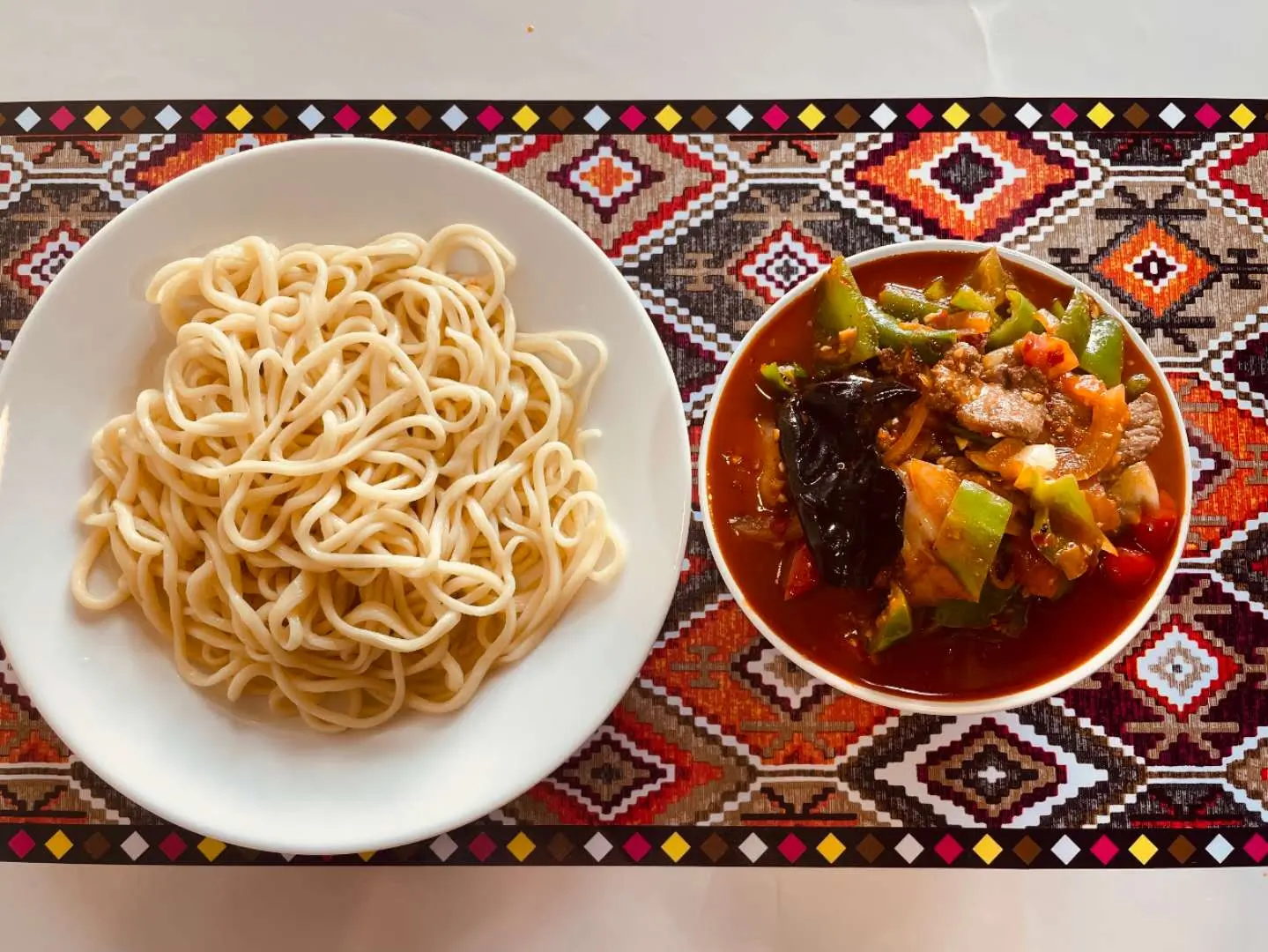 Hand - pulled noodles served with meat and vegetable sauce at Babahan Uyghur Cafe, a Chinese Xinjiang Flavors Restaurant in Plano