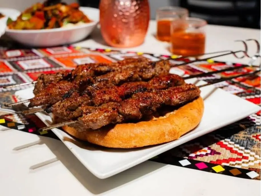 Babahan-Uyghur-Cafe-Chinese-Xinjiang-Flavors-Restaurant-Lamb-Kebab-with-Naan-Bread-Plano Lamb kebabs served on naan bread at Babahan Uyghur Cafe, a Chinese Xinjiang Flavors Restaurant in Plano