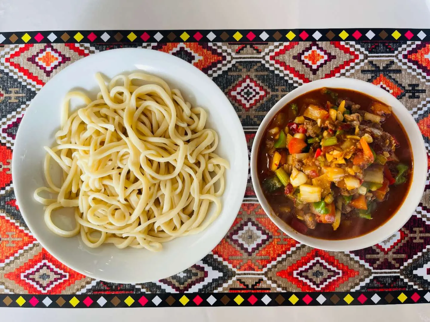 Noodles paired with mixed vegetable and meat sauce at Babahan Uyghur Cafe, a Chinese Xinjiang Flavors Restaurant in Plano